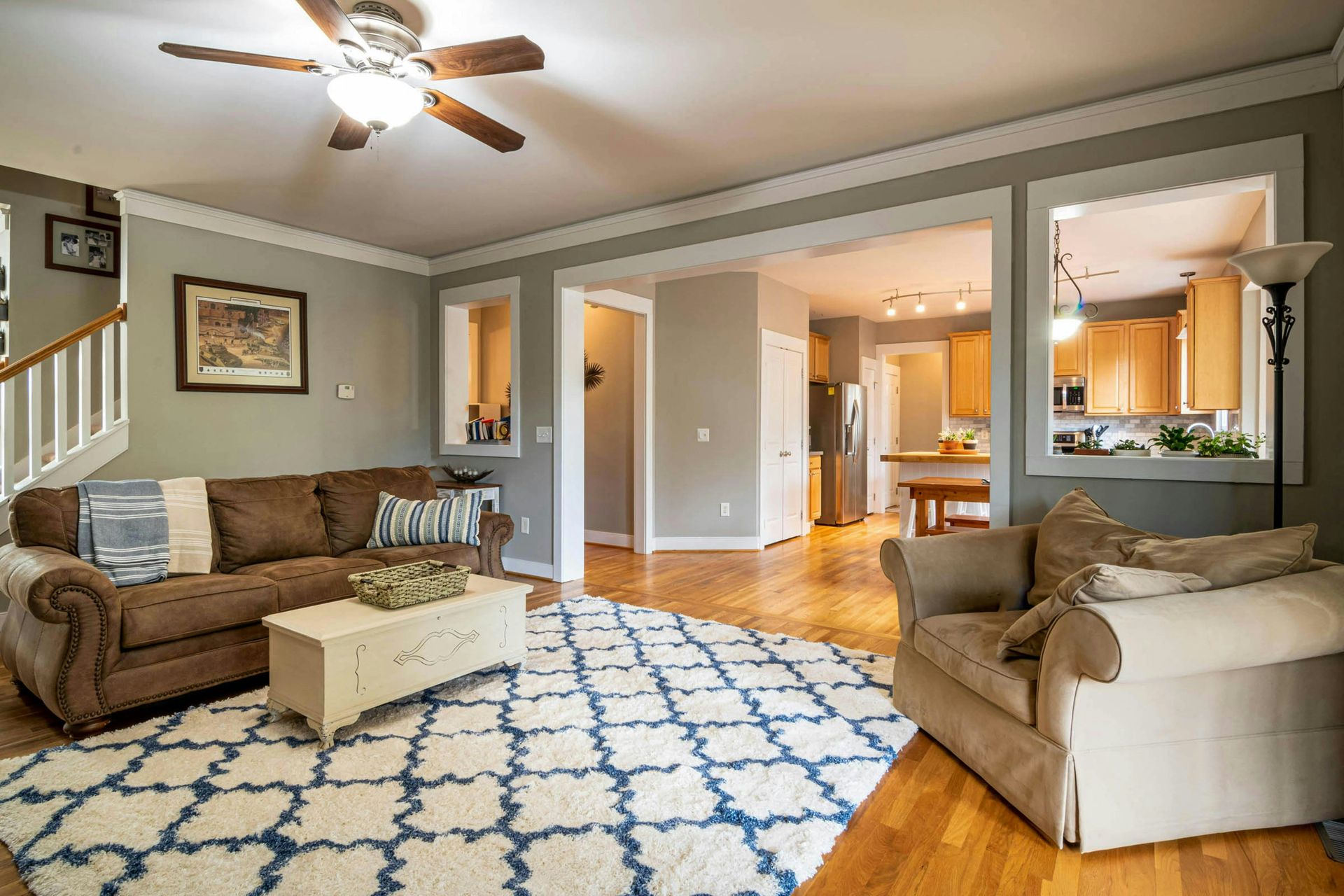 Cozy living room with brown sofa and patterned rug
